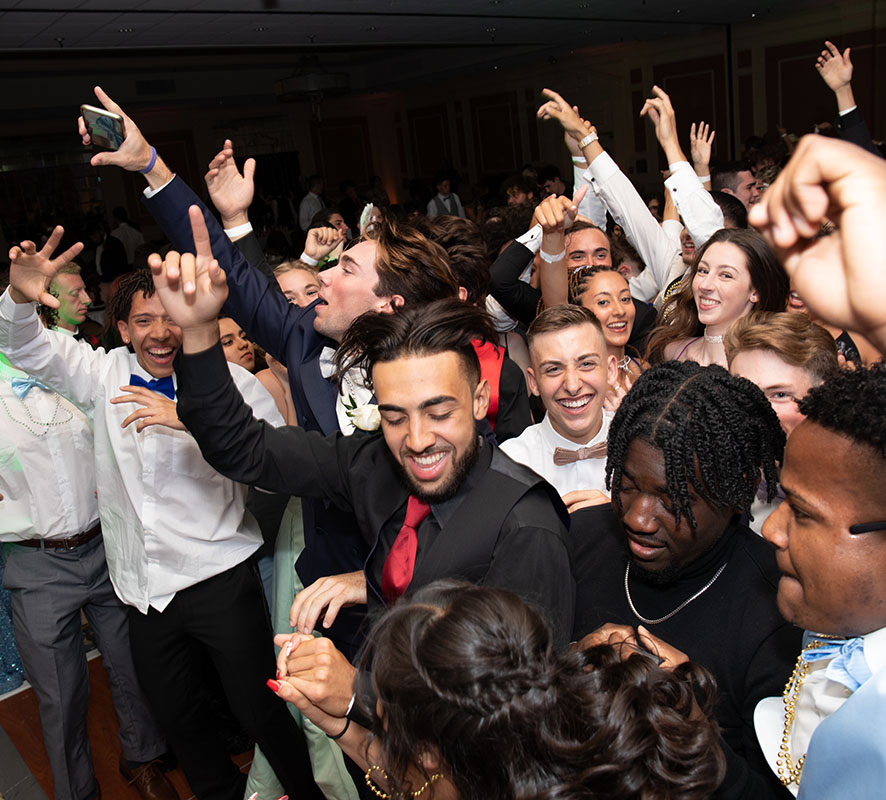 Students throwing their hands in the air like they just don't care.