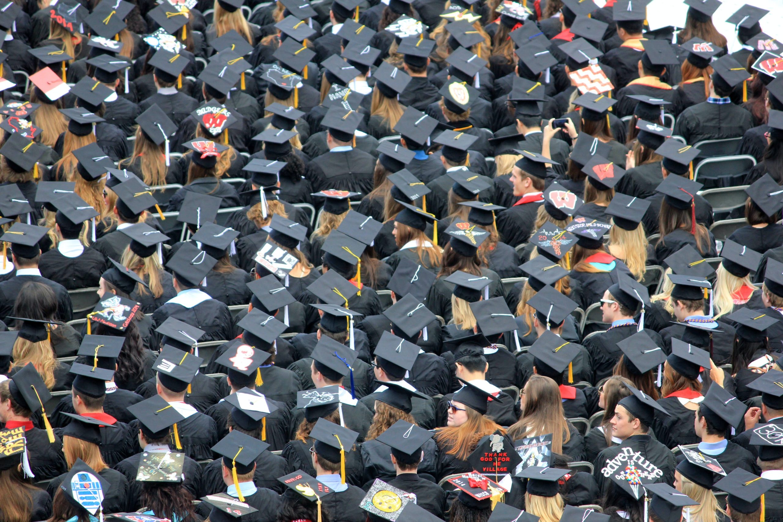 Graduates sitting in an audience. 