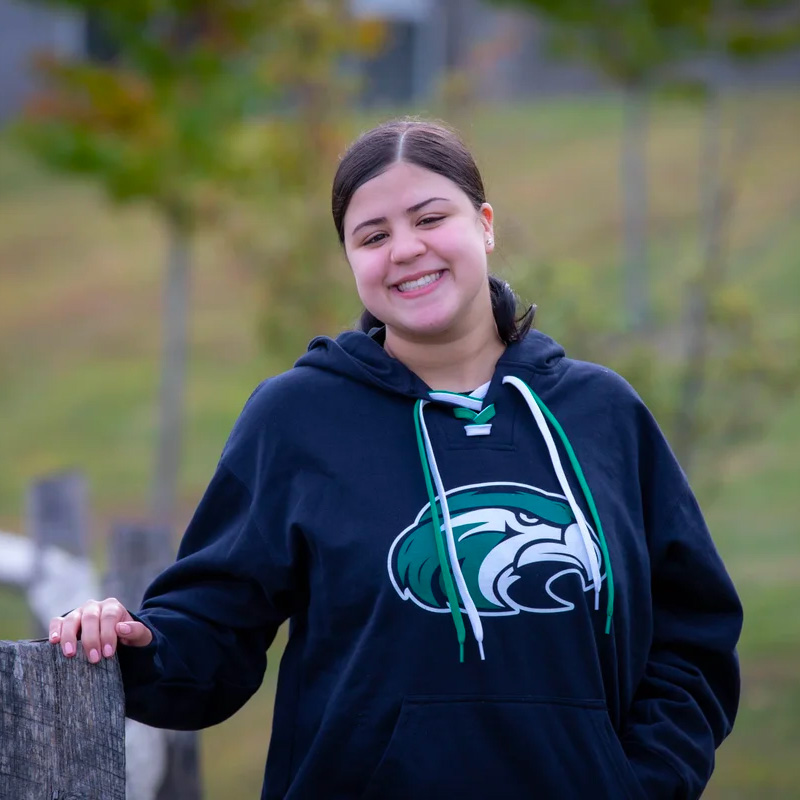 Student wearing a Hawks hoody.