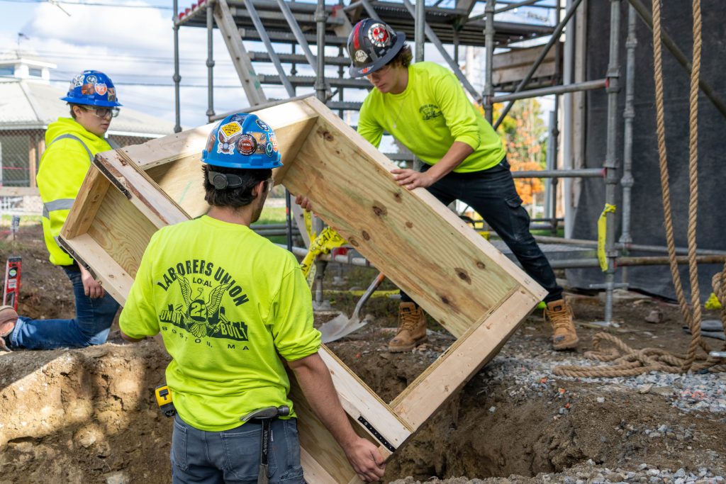 Two students in CCL work on the Larkin Cottage.